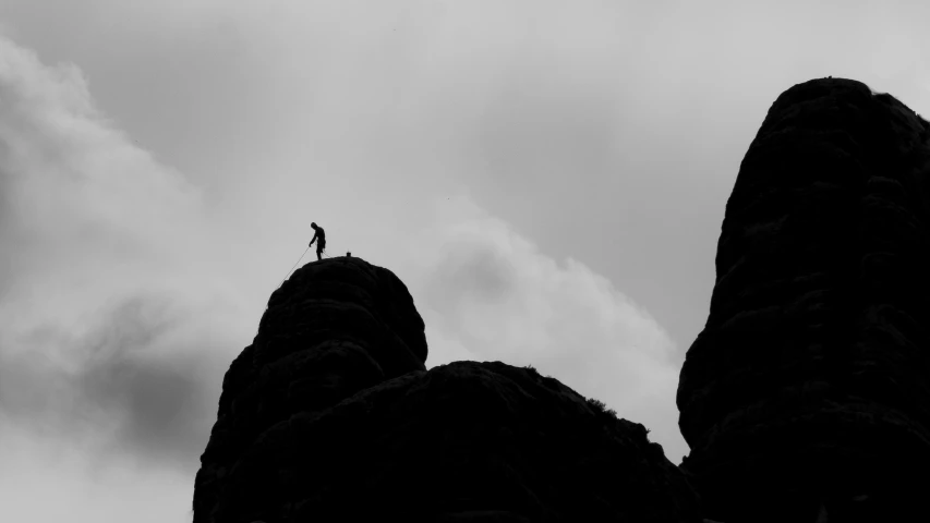 person standing on top of a rock formation