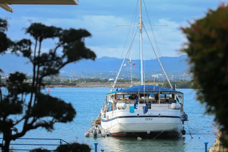 boats docked at the dock with mountains in background