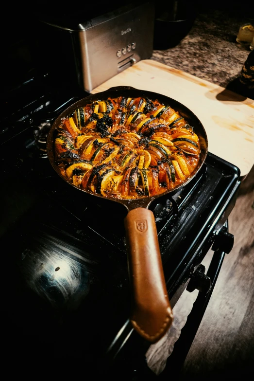 a pan of food is cooking on the stove top