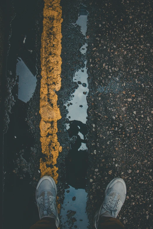 a person stands on the street next to dles