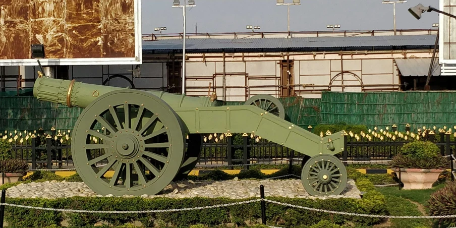 an old style cannon is in a garden