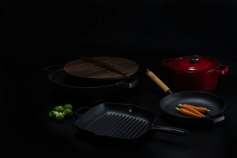 the cooking set with carrots on the table