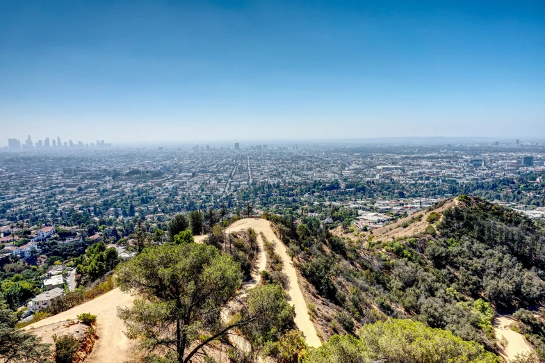 an aerial view of the city from a hill