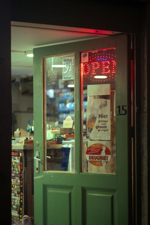 the door to a store with large words written on the glass