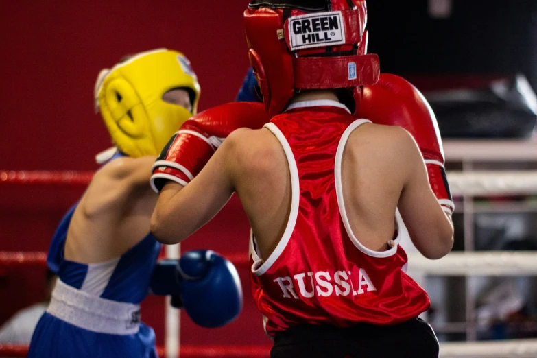 two boxers face off on a boxing ring