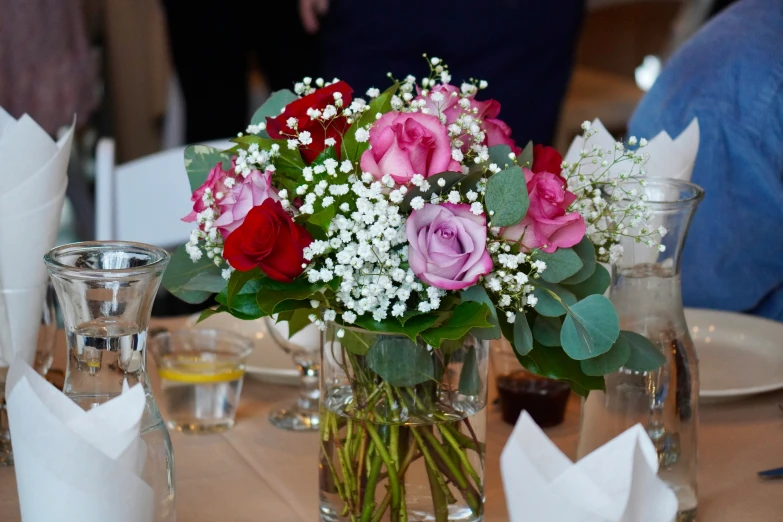 colorful flowers in a vase sitting on a table