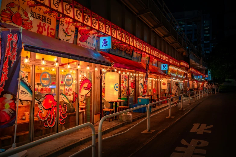 some food stands lined up outside at night
