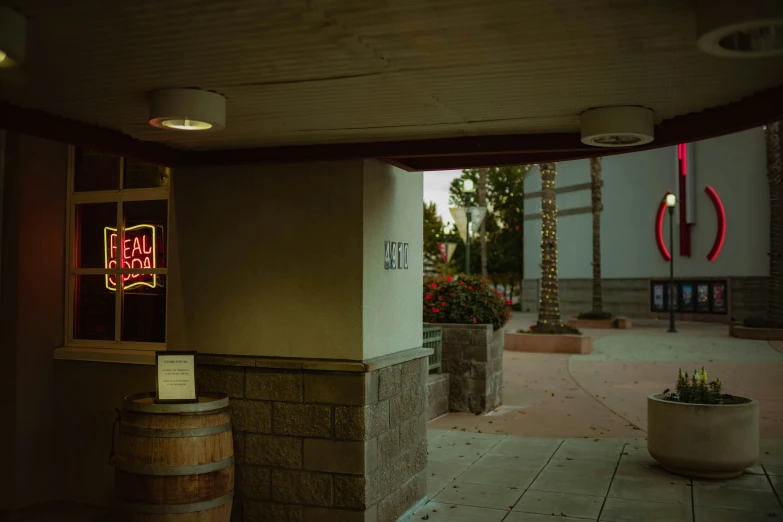 there is an outside area with a sign and barrel