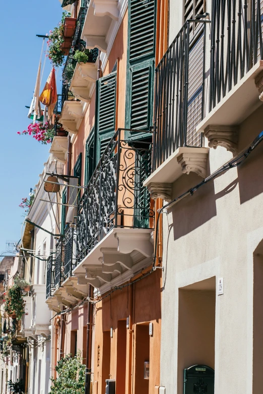 many buildings that have different iron railings on them