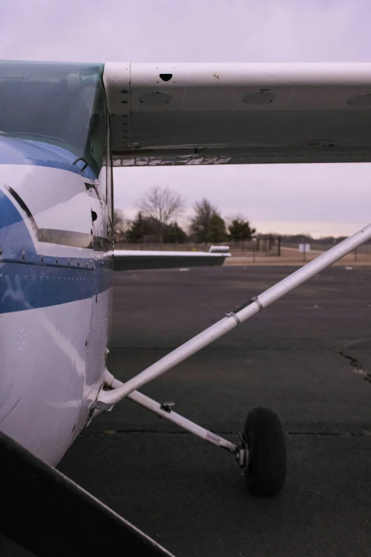 closeup of a small plane on a concrete tarmac