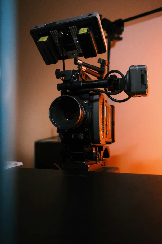 a camera on top of a table with a flash light shining