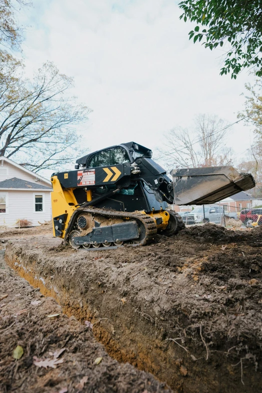 the tractor is moving the earth behind it