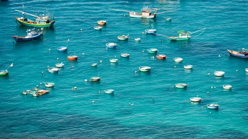 boats docked off the coast of a harbor