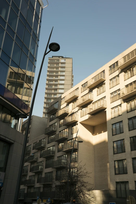 two tall building next to each other near a street light