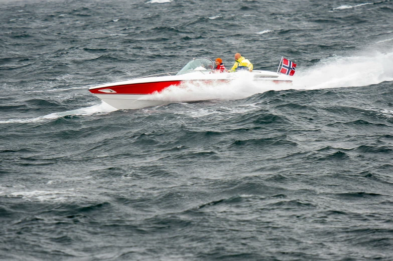 people in a motor boat riding on the water