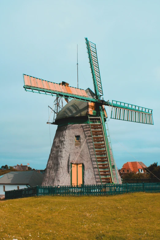 a windmill with ladders that are next to it