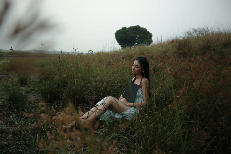 woman in the middle of a meadow with her hair back