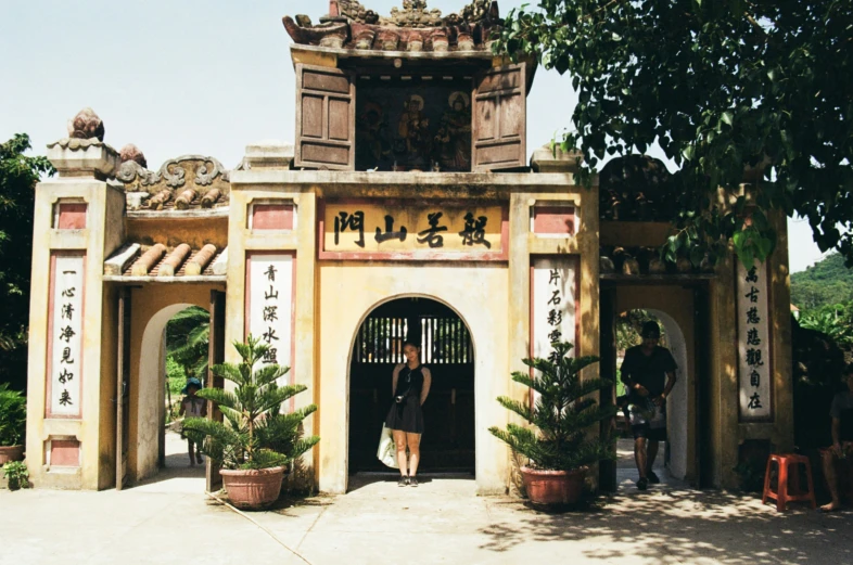 a building with two women standing in front of it