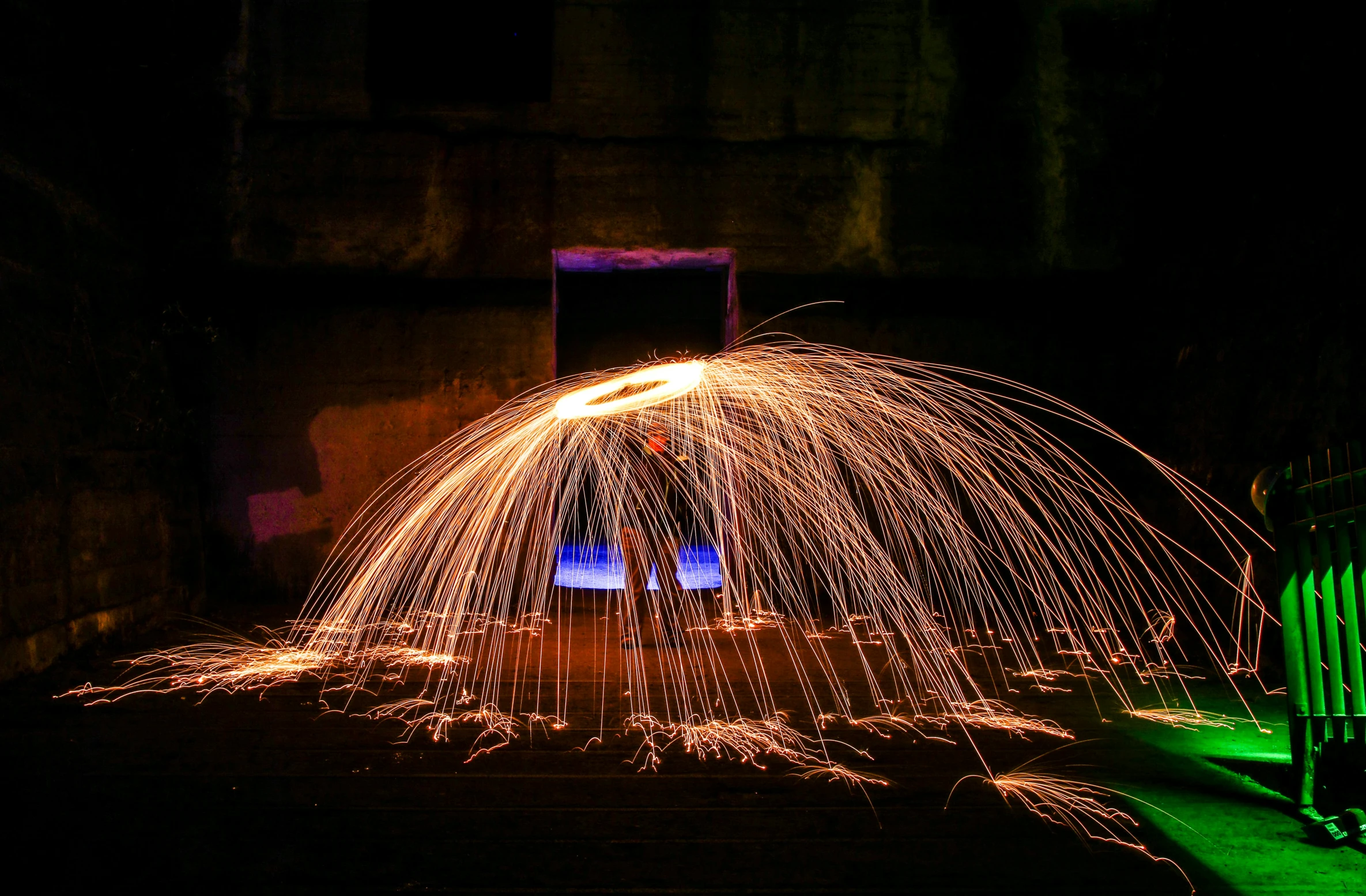 light show coming from a tunnel, outdoors