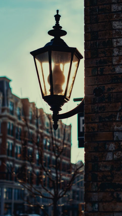 a lamp hanging from the side of a building