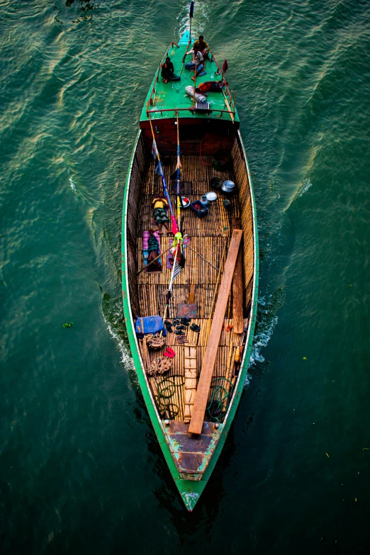 a small boat sailing in a big body of water