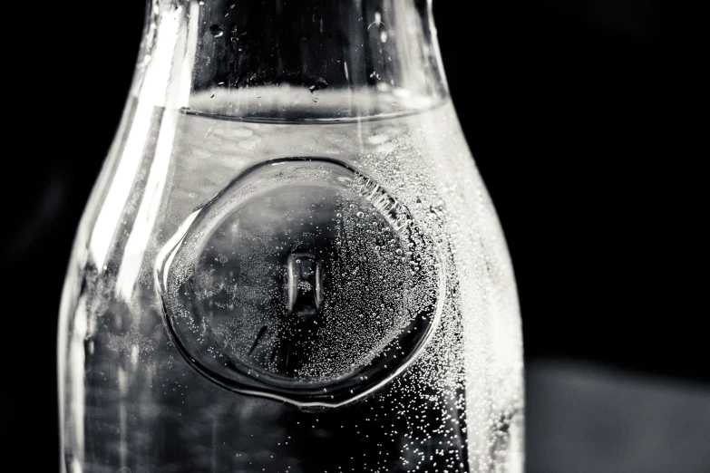 water in a glass bottle filled with a lot of bubbles