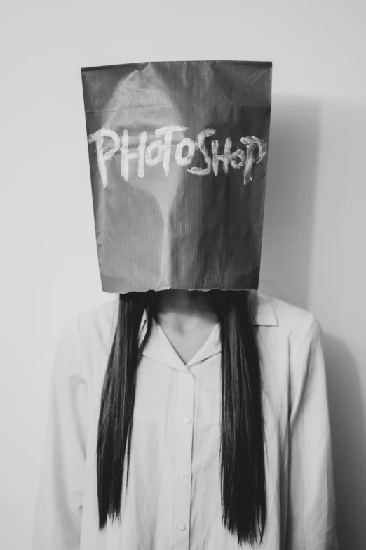 a woman wearing a paper bag on her head