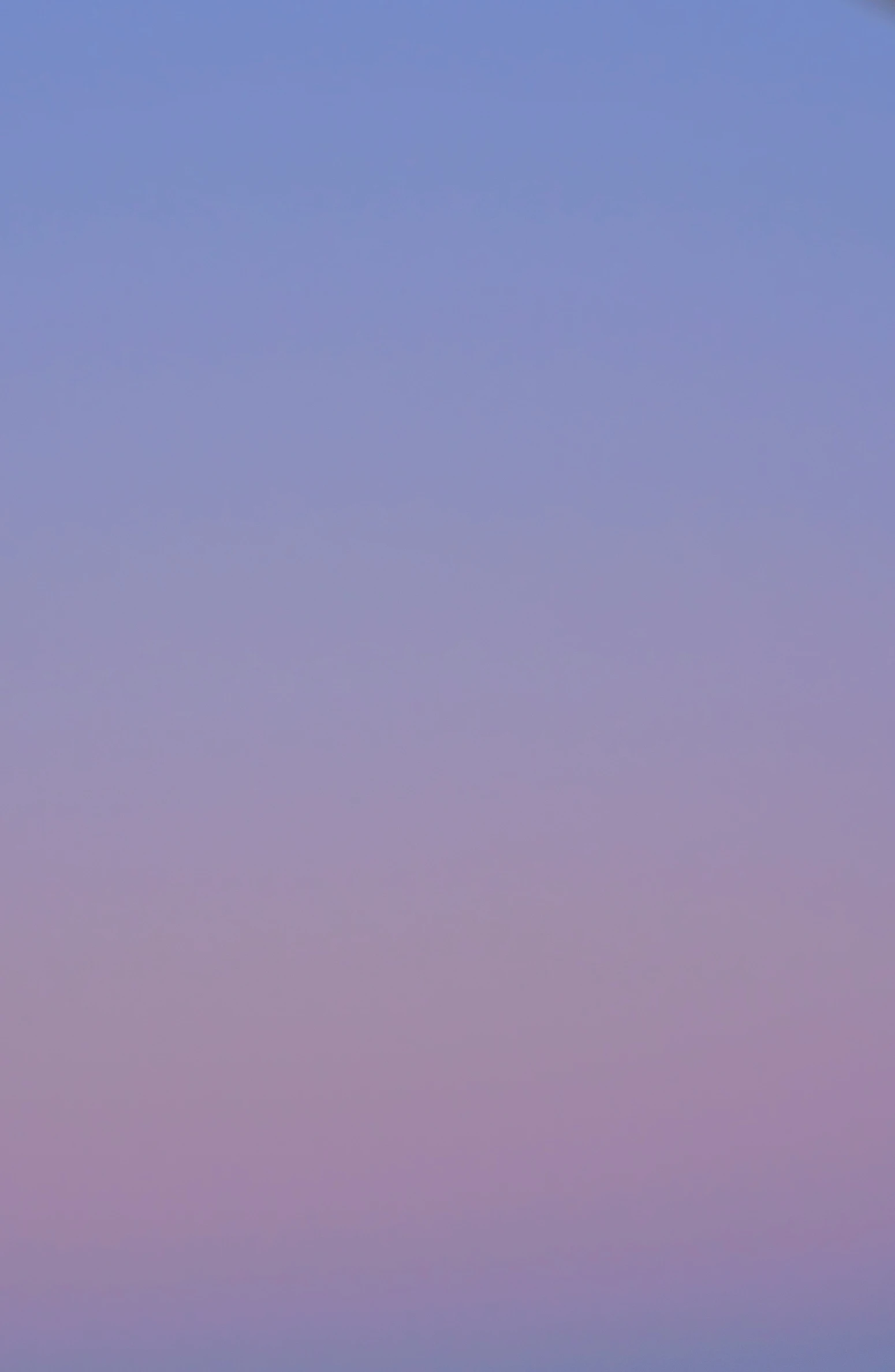 jet airplane flying over an ocean near a beach