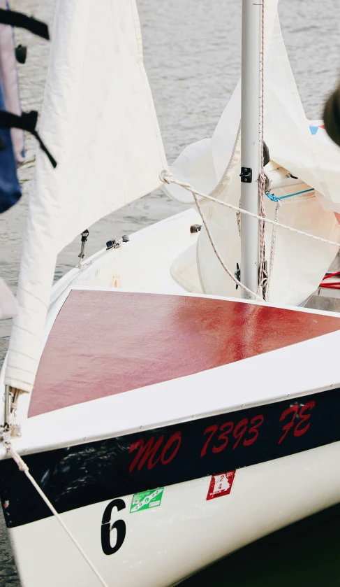 the boat has a red front, red side and blue side