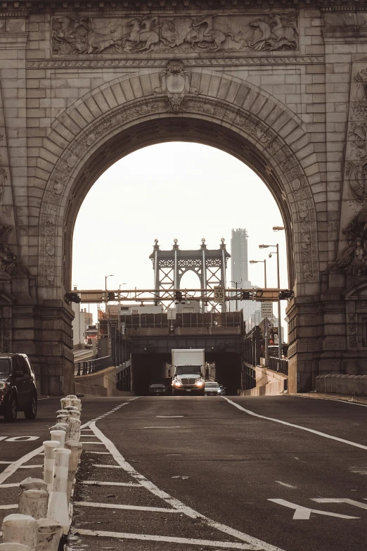 an old bridge that has been built around a highway