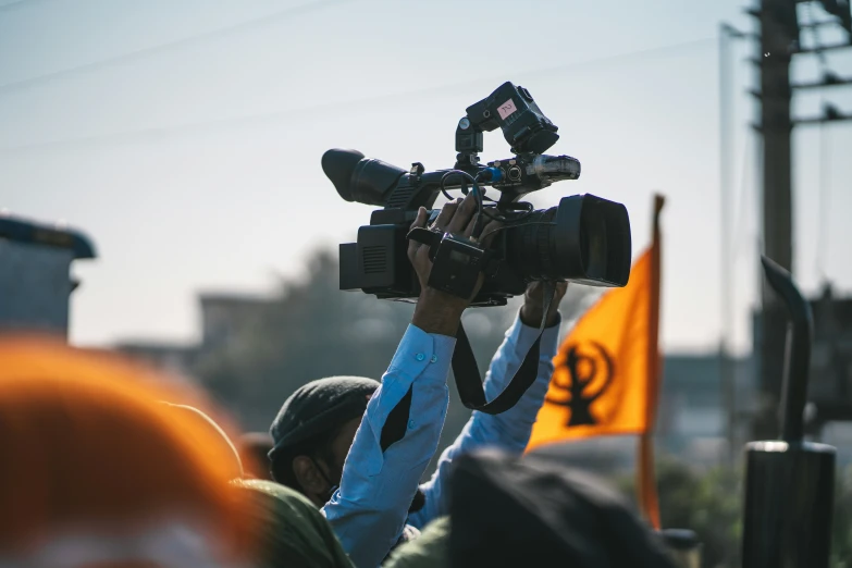 camera set up on tripod for an outdoor event