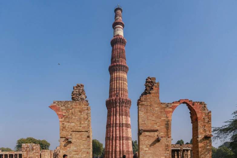 an abandoned old brick structure with a tall bell tower