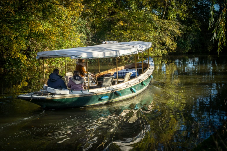 two people in a small boat on the river