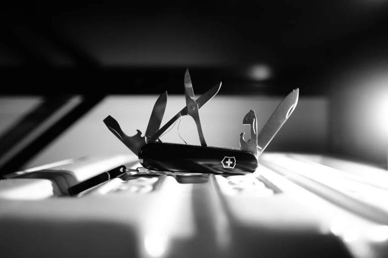 a black and white po of a swiss army knife