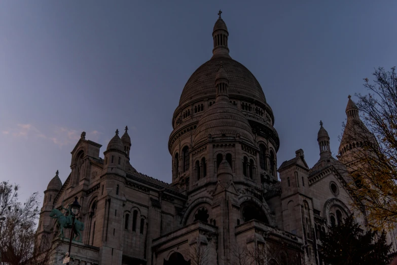 a large building with towers and a dome on top