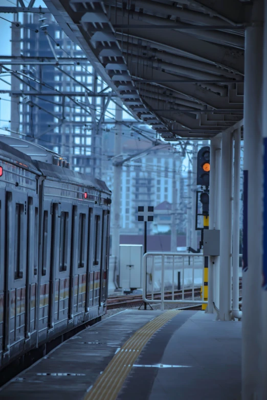 two trains are stopped at the empty train station