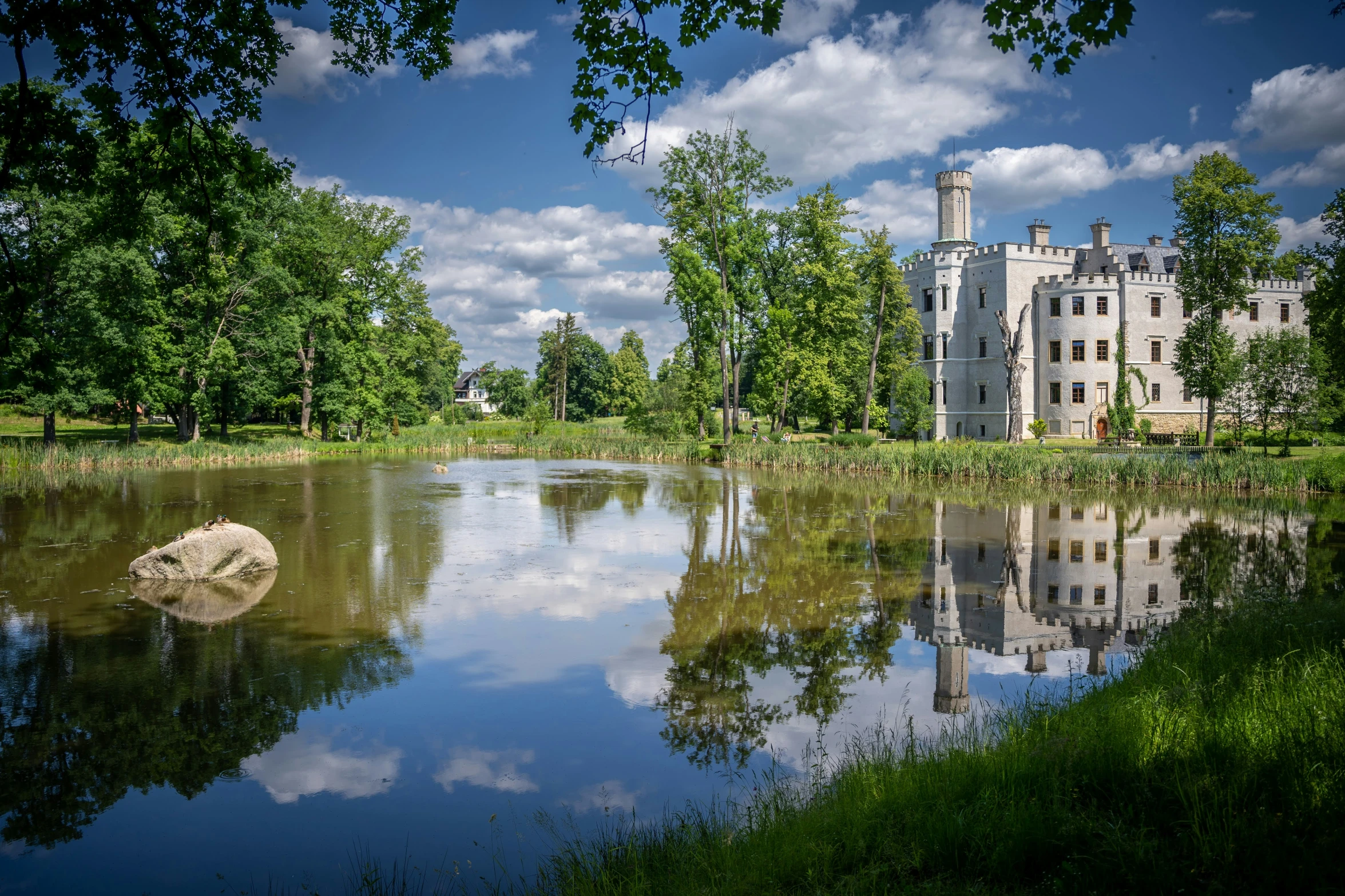 a castle next to a body of water