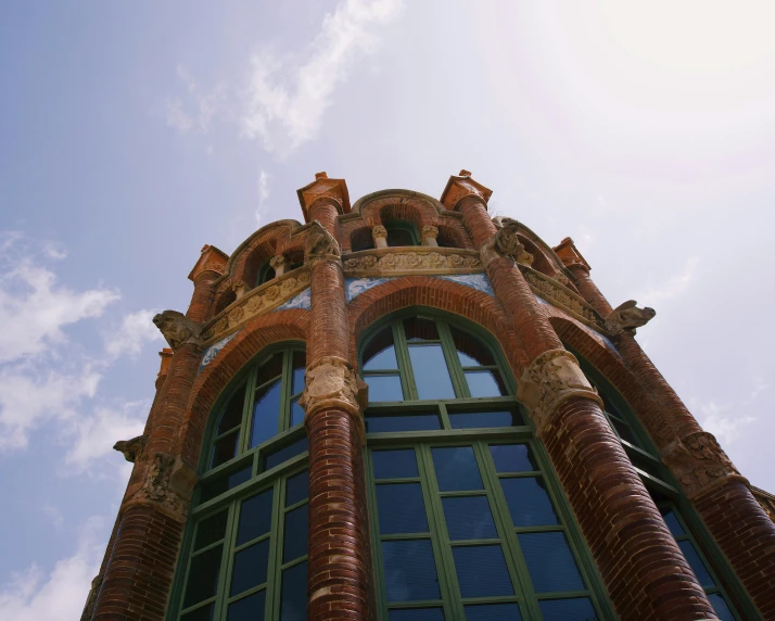 an unusual building with lots of columns and arches