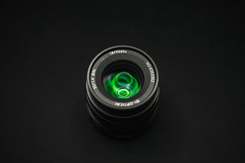 a close up of a camera lens on a black surface