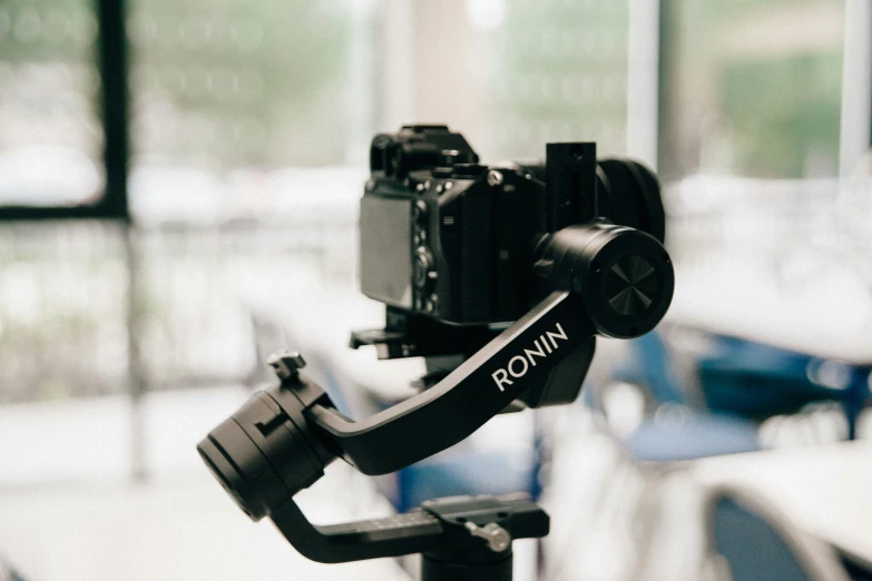 a camera mounted on a tripod in a room