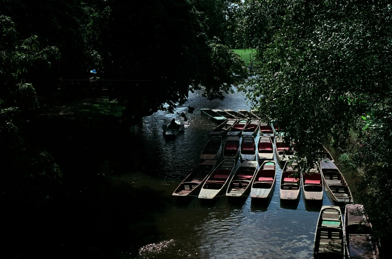 there are rows of boats floating in the water