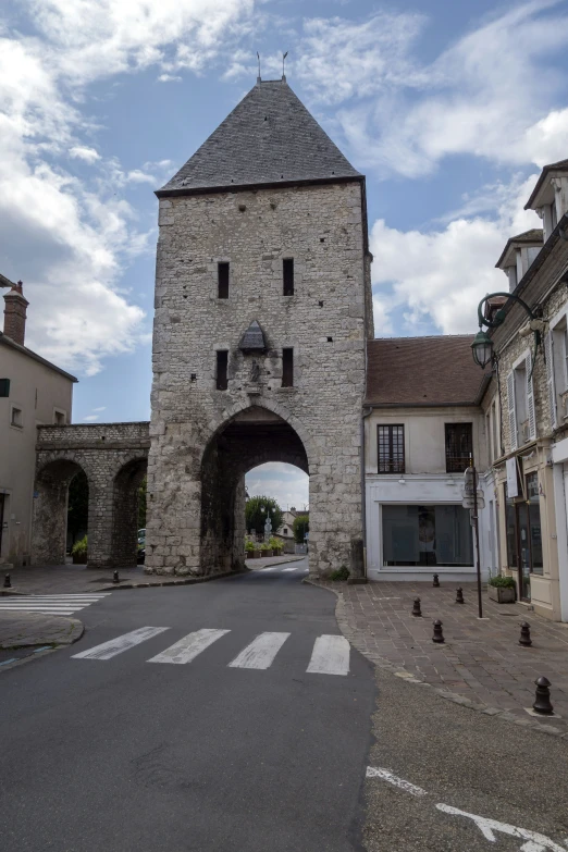 a very pretty old stone building with an archway