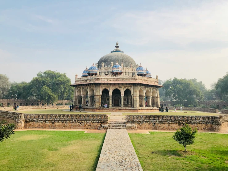 an elaborate structure with trees and plants on the sides