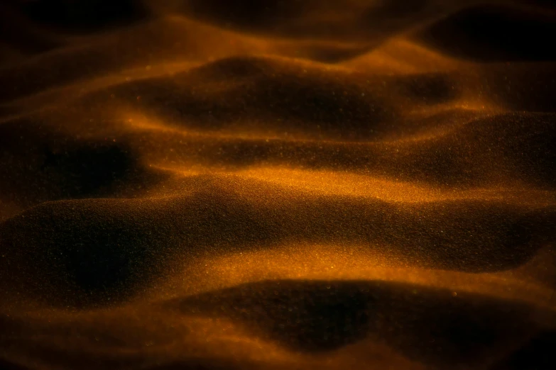 the surface is covered in gold, like sand