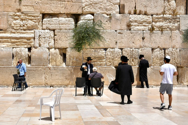 people walk and relax in the courtyards of the waive