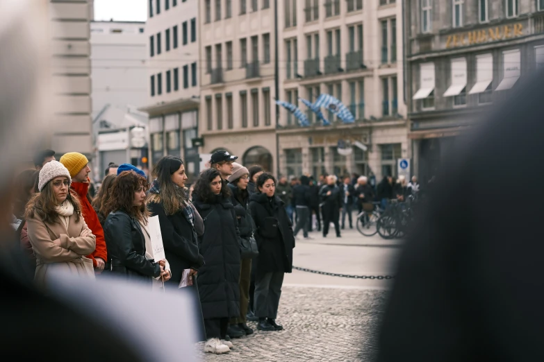 some people standing together and wearing some hats