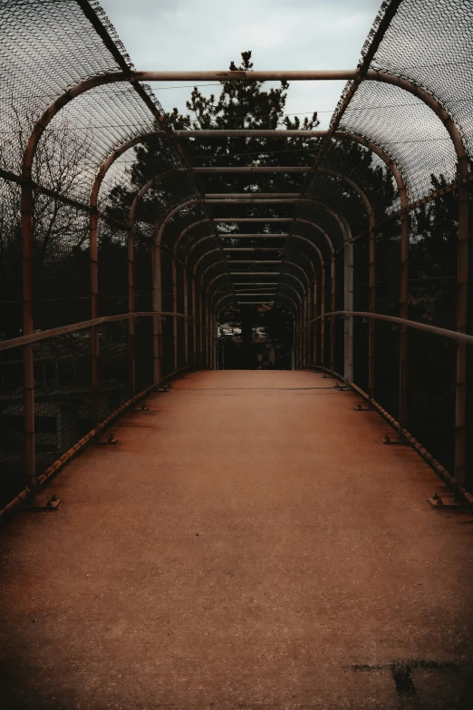 an empty walkway on the side of a building