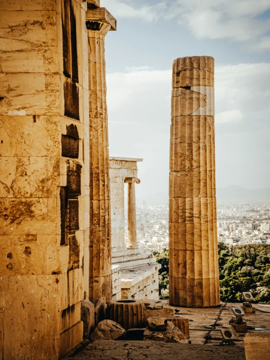 some very old columns by some pretty ruins