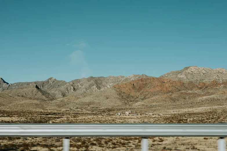 a very tall mountain range with cars parked on it