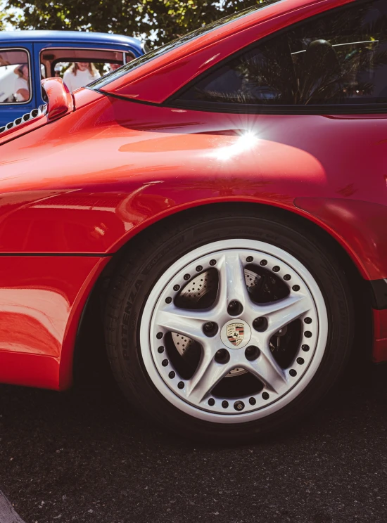 a close up view of the front wheel of a car